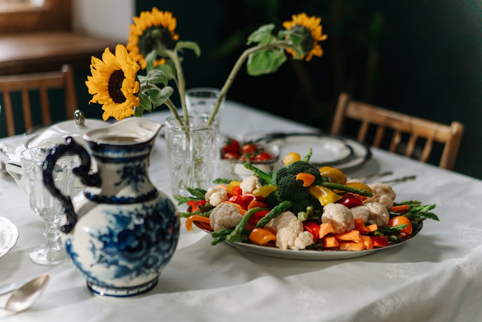 Vibrant red, yellow, and orange bell peppers arranged on a rustic wooden table surface